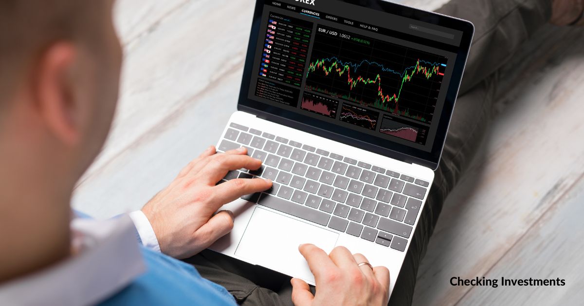 Man checking investment chart on laptop